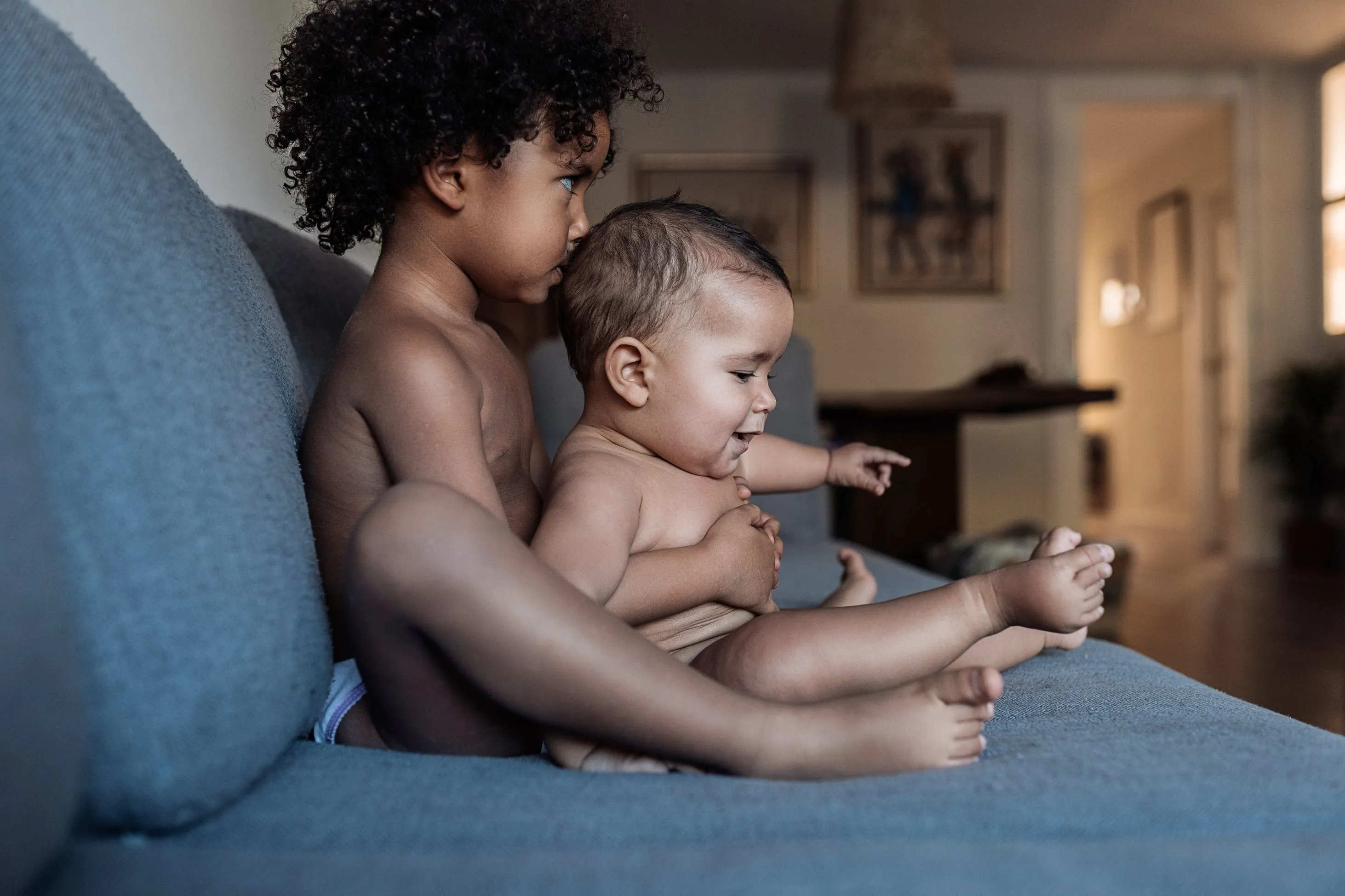 Baby siblings on couch