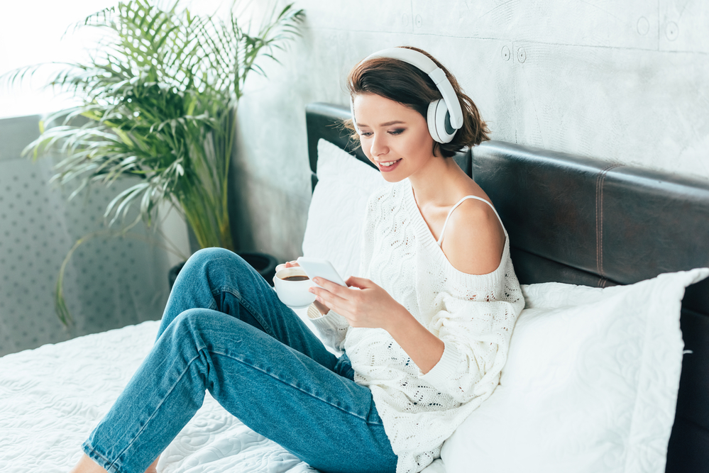 woman listening to an infertility podcast