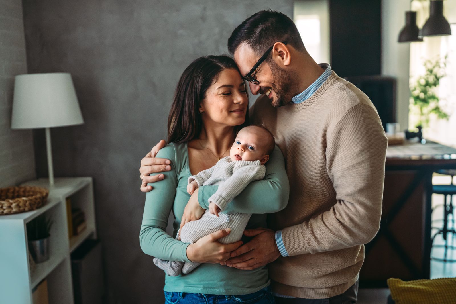 Parents spend happy moments with the newborn child